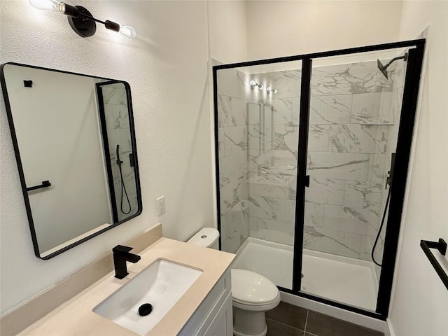 1811 Webberville Rd Unit 1206, Austin, TX 78721 - bathroom featuring toilet, a marble finish shower, vanity, and tile patterned floors