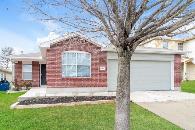 13604 Sierra Wind Ln, Elgin, TX 78621 - view of front of property with brick siding, driveway, and a front yard