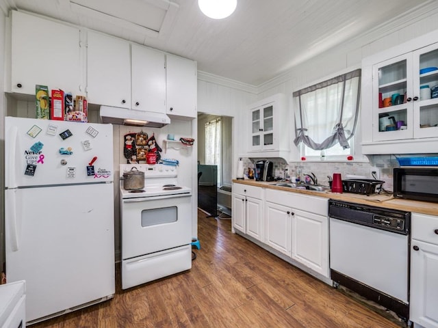 kitchen with white cabinets, under cabinet range hood, white appliances, and a sink