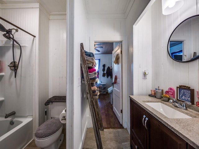 full bath featuring vanity, shower / tub combination, ornamental molding, toilet, and wood walls