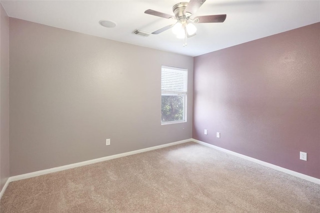 2025 Wayward Sun Dr, Austin, TX 78754 - carpeted spare room featuring baseboards and a ceiling fan