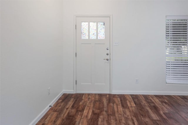 2025 Wayward Sun Dr, Austin, TX 78754 - entryway with dark wood-type flooring and baseboards
