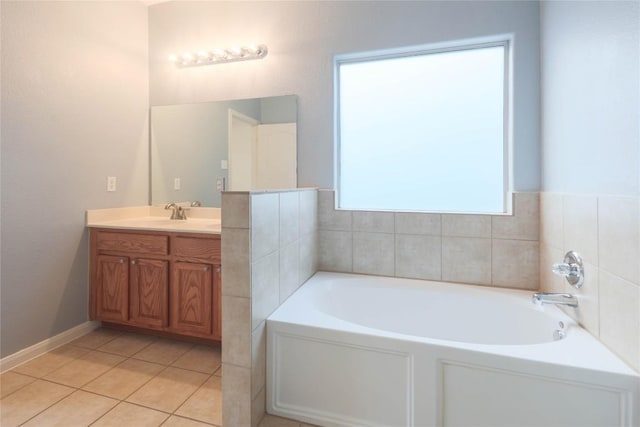 2025 Wayward Sun Dr, Austin, TX 78754 - full bath featuring vanity, a garden tub, and tile patterned floors