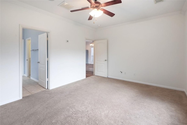 2025 Wayward Sun Dr, Austin, TX 78754 - empty room featuring light carpet, crown molding, and a ceiling fan