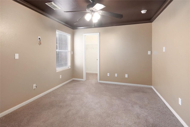 2025 Wayward Sun Dr, Austin, TX 78754 - carpeted spare room featuring ceiling fan, crown molding, and a smoke detector
