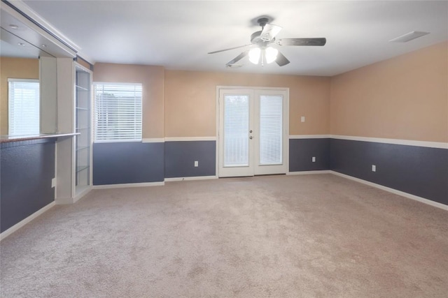 2025 Wayward Sun Dr, Austin, TX 78754 - carpeted empty room featuring a ceiling fan and french doors