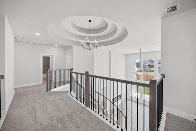 hallway featuring visible vents, baseboards, an upstairs landing, recessed lighting, and attic access