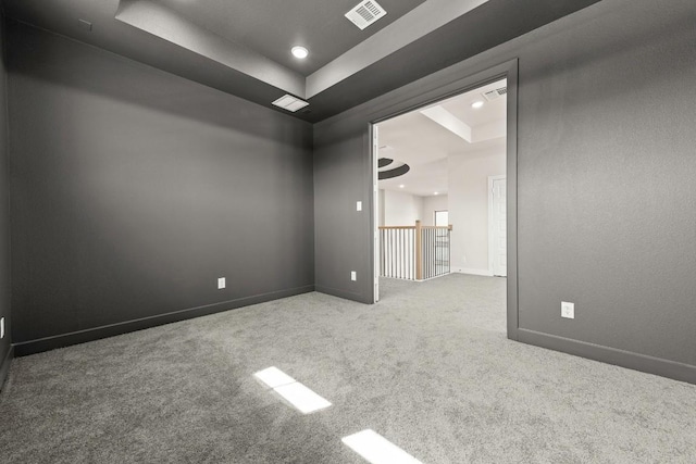 212 Ranchland Pass, Liberty Hill, TX 78642 - spare room with a raised ceiling, carpet floors, baseboards, and recessed lighting