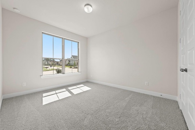 212 Ranchland Pass, Liberty Hill, TX 78642 - spare room with carpet floors, baseboards, and a smoke detector