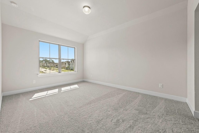 212 Ranchland Pass, Liberty Hill, TX 78642 - carpeted spare room featuring baseboards, a smoke detector, and vaulted ceiling