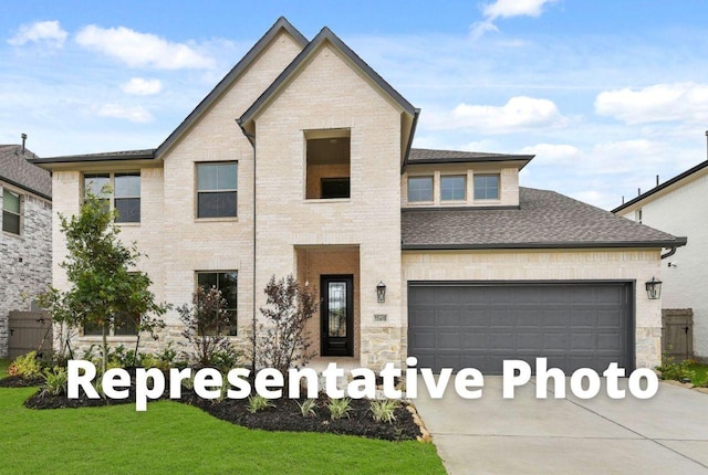 212 Ranchland Pass, Liberty Hill, TX 78642 - view of front of home with driveway, a garage, roof with shingles, and a front lawn