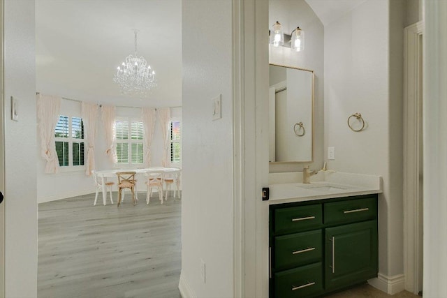 132 Archipelago Trl, Austin, TX 78717 - bathroom with wood finished floors, vanity, a chandelier, and a soaking tub