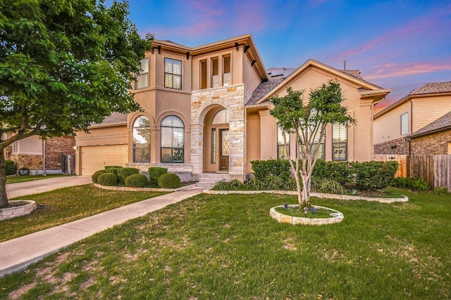 132 Archipelago Trl, Austin, TX 78717 - view of front of house with stucco siding, stone siding, roof mounted solar panels, concrete driveway, and a garage