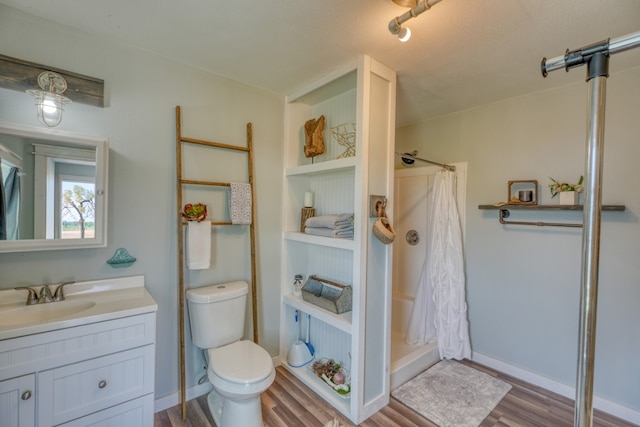 452 Sandy Cemetery Rd, Johnson City, TX 78636 - full bath with toilet, wood finished floors, a shower with curtain, and vanity