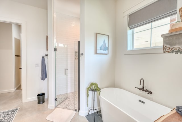 452 Sandy Cemetery Rd, Johnson City, TX 78636 - bathroom with baseboards, concrete flooring, a stall shower, and a soaking tub