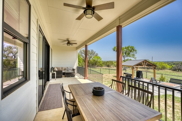 452 Sandy Cemetery Rd, Johnson City, TX 78636 - deck with outdoor lounge area, a ceiling fan, a gazebo, area for grilling, and outdoor dining space