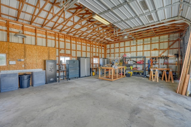 452 Sandy Cemetery Rd, Johnson City, TX 78636 - garage featuring metal wall and a workshop area