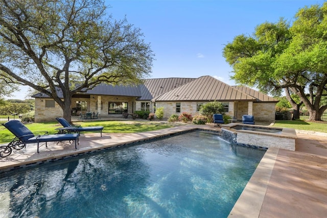 27501 Waterfall Hill Pkwy, Spicewood, TX 78669 - view of swimming pool with a patio, a pool with connected hot tub, and a lawn