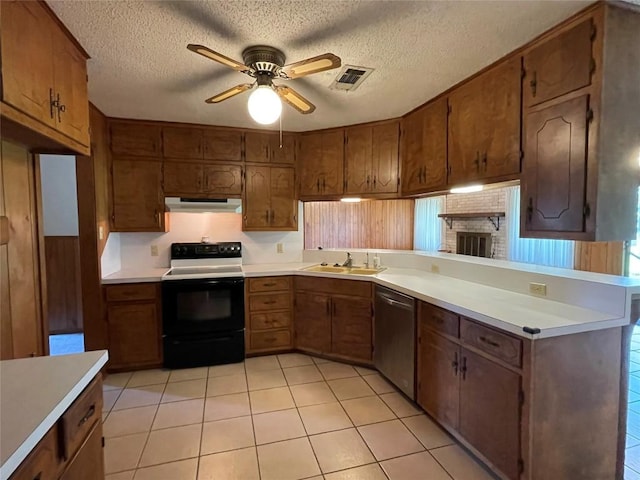 604 E Kerr St, Burnet, TX 78611 - kitchen with stainless steel dishwasher, electric range, under cabinet range hood, a peninsula, and ceiling fan