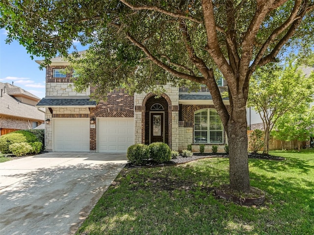 view of front of home with concrete driveway, stone siding, an attached garage, fence, and a front yard