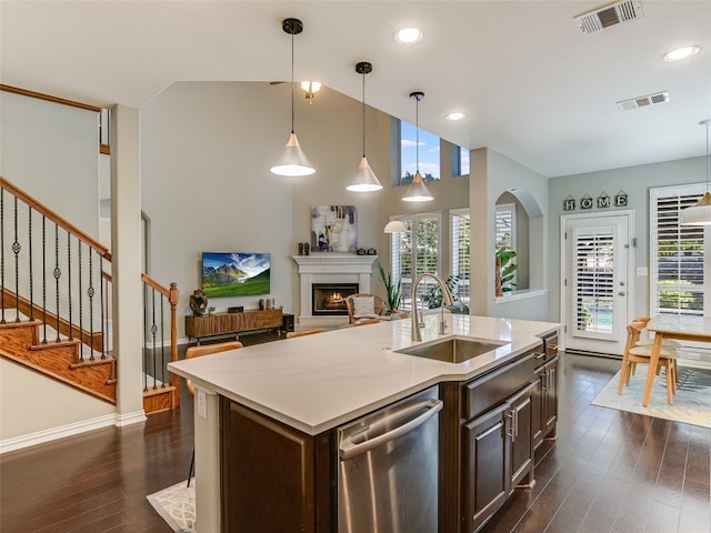kitchen featuring stainless steel dishwasher, a wealth of natural light, visible vents, and a sink