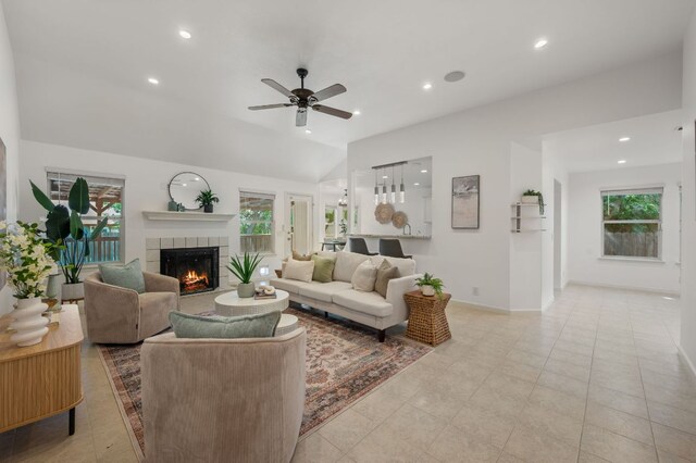 510 Sunny Brook Dr, Leander, TX 78641 - living area with a tiled fireplace, healthy amount of natural light, a ceiling fan, recessed lighting, and light tile patterned flooring
