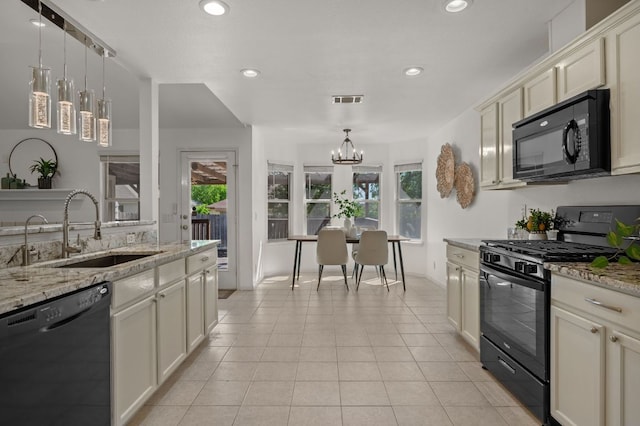 510 Sunny Brook Dr, Leander, TX 78641 - kitchen featuring black appliances, a chandelier, healthy amount of natural light, decorative light fixtures, and recessed lighting