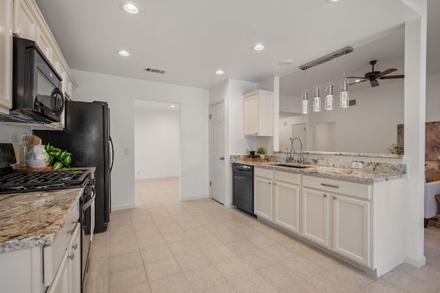 510 Sunny Brook Dr, Leander, TX 78641 - kitchen with black appliances, ceiling fan, light stone counters, recessed lighting, and white cabinetry