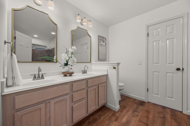 510 Sunny Brook Dr, Leander, TX 78641 - full bath featuring double vanity, wood finished floors, and tiled shower