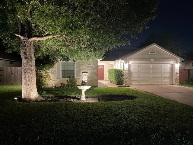 510 Sunny Brook Dr, Leander, TX 78641 - view of property hidden behind natural elements with concrete driveway, stone siding, and an attached garage