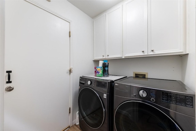 4010 Halfway Cv, Round Rock, TX 78681 - laundry area featuring washer and clothes dryer and cabinet space