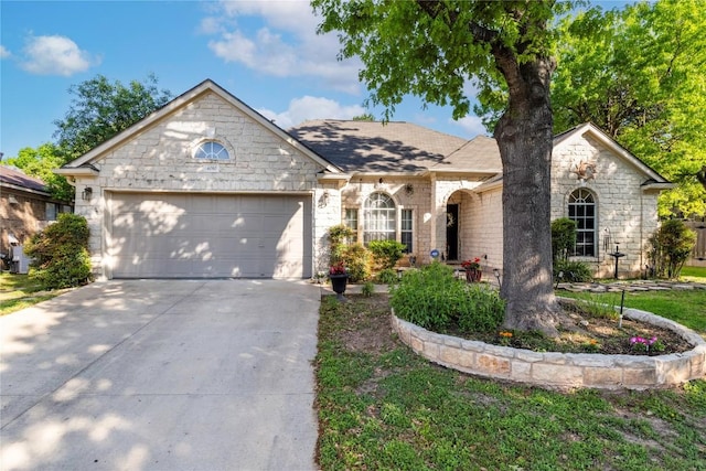 4010 Halfway Cv, Round Rock, TX 78681 - view of front of house with a garage, stone siding, and concrete driveway