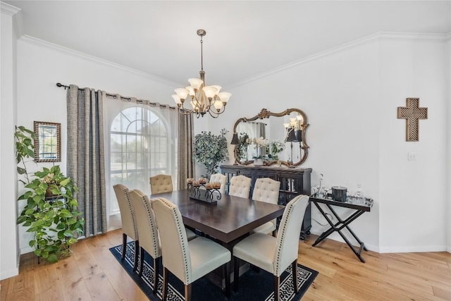 4010 Halfway Cv, Round Rock, TX 78681 - dining space featuring light wood-style floors, crown molding, a notable chandelier, and baseboards