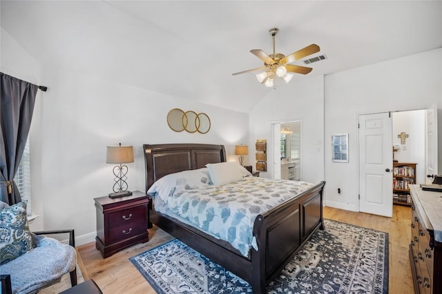 4010 Halfway Cv, Round Rock, TX 78681 - bedroom with lofted ceiling, light wood-style floors, visible vents, and baseboards