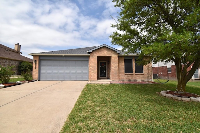 2305 Love Rd, Killeen, TX 76542 - single story home with concrete driveway, brick siding, a front yard, and an attached garage