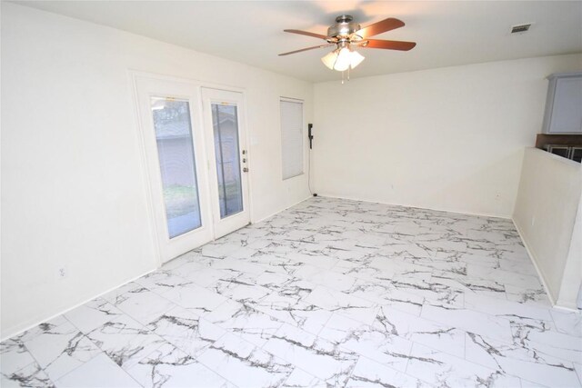 2305 Love Rd, Killeen, TX 76542 - spare room with a ceiling fan, light marble finish floors, and baseboards
