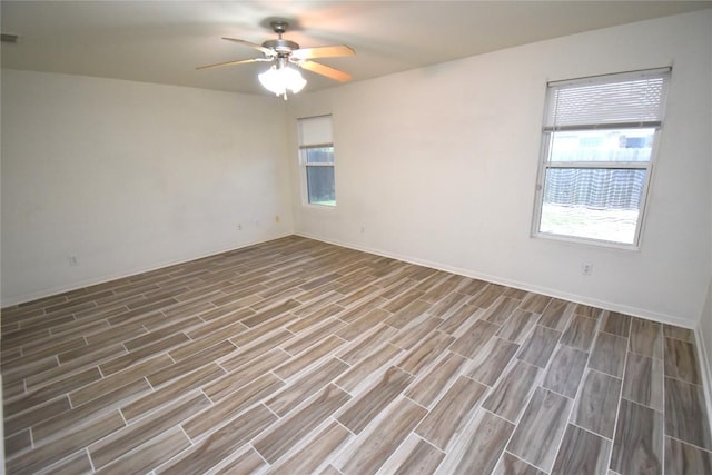 2305 Love Rd, Killeen, TX 76542 - empty room with wood finished floors, baseboards, a ceiling fan, and visible vents