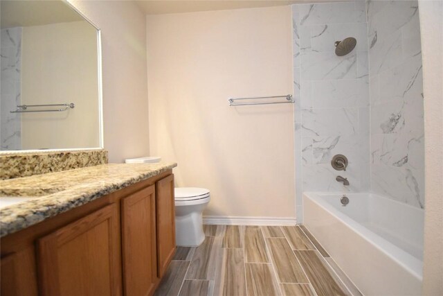 2305 Love Rd, Killeen, TX 76542 - full bath featuring vanity, toilet, shower / bathtub combination, baseboards, and wood tiled floors