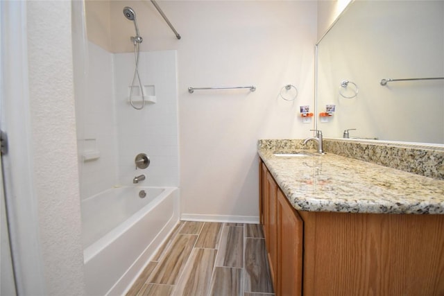 2305 Love Rd, Killeen, TX 76542 - bathroom featuring vanity, baseboards, wood finish floors, and tub / shower combination