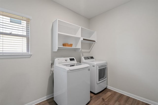 506 Windy Reed Rd, Hutto, TX 78634 - washroom with separate washer and dryer and dark wood-style flooring