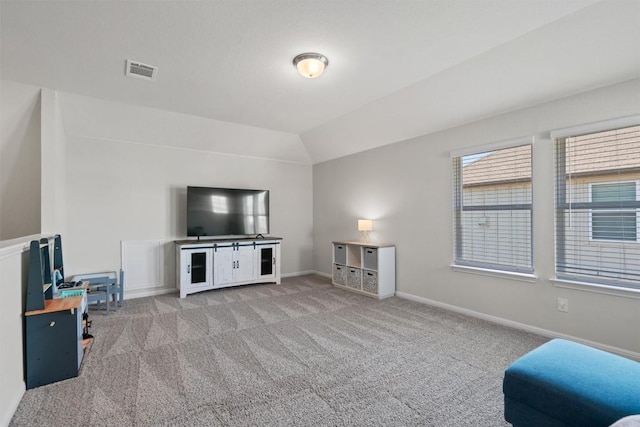 506 Windy Reed Rd, Hutto, TX 78634 - carpeted living room with baseboards and lofted ceiling