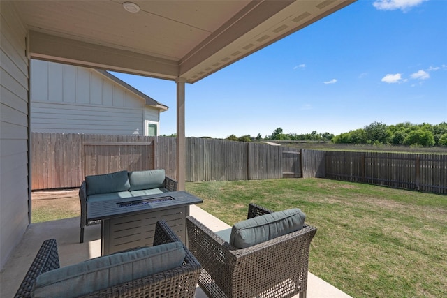 506 Windy Reed Rd, Hutto, TX 78634 - fenced backyard with a patio area and an outdoor living space with a fire pit