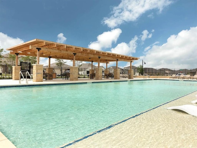 506 Windy Reed Rd, Hutto, TX 78634 - community pool featuring a pergola
