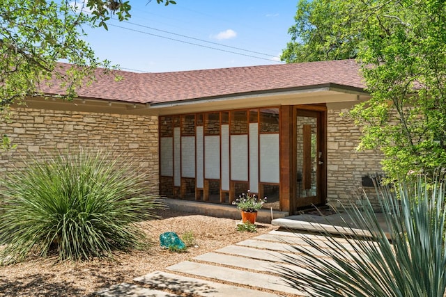 5322 Western Hills Dr, Austin, TX 78731 - entrance to property featuring stone siding and roof with shingles