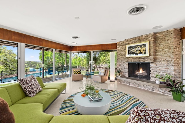5322 Western Hills Dr, Austin, TX 78731 - living area with speckled floor, a fireplace, and visible vents