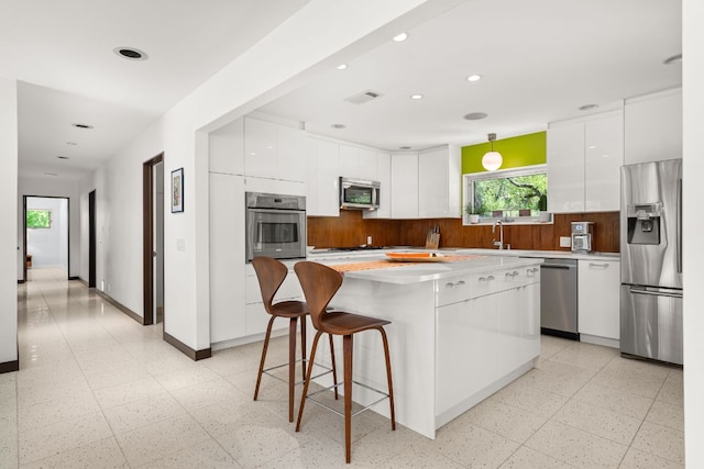 5322 Western Hills Dr, Austin, TX 78731 - kitchen featuring modern cabinets, visible vents, white cabinetry, and stainless steel appliances