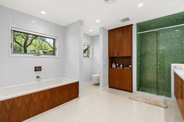 5322 Western Hills Dr, Austin, TX 78731 - full bathroom with visible vents, toilet, a shower stall, vanity, and a garden tub