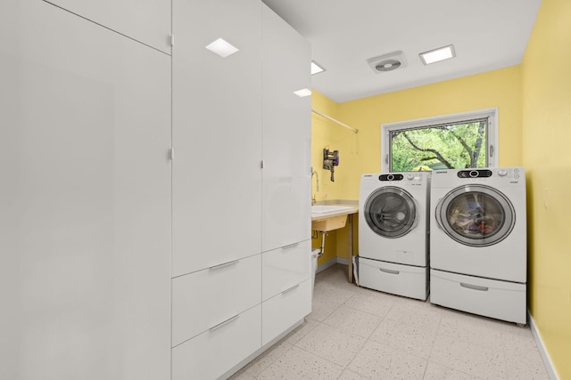 5322 Western Hills Dr, Austin, TX 78731 - laundry room with washer and clothes dryer, laundry area, and baseboards