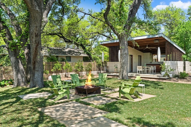 5322 Western Hills Dr, Austin, TX 78731 - view of yard with a deck, a patio, fence, and a fire pit