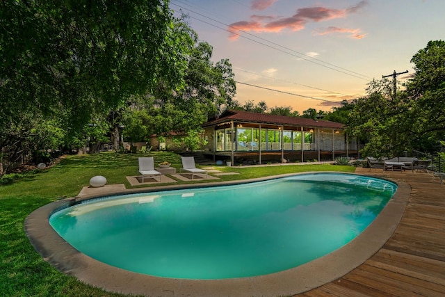 5322 Western Hills Dr, Austin, TX 78731 - pool at dusk with an outdoor pool, outdoor lounge area, a deck, and a lawn